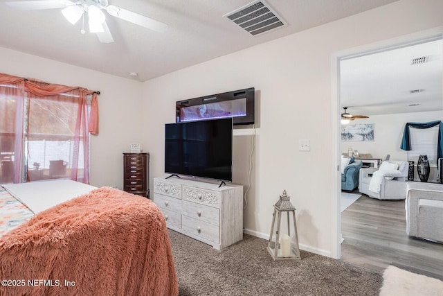 95170 Timberlake Dr, Fernandina Beach, FL 32034 - bedroom featuring light carpet, baseboards, visible vents, and a ceiling fan