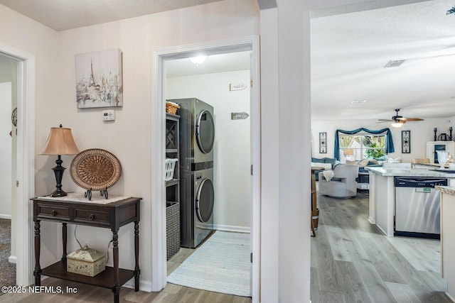 95170 Timberlake Dr, Fernandina Beach, FL 32034 - hallway with light wood-style flooring, baseboards, and stacked washer / drying machine