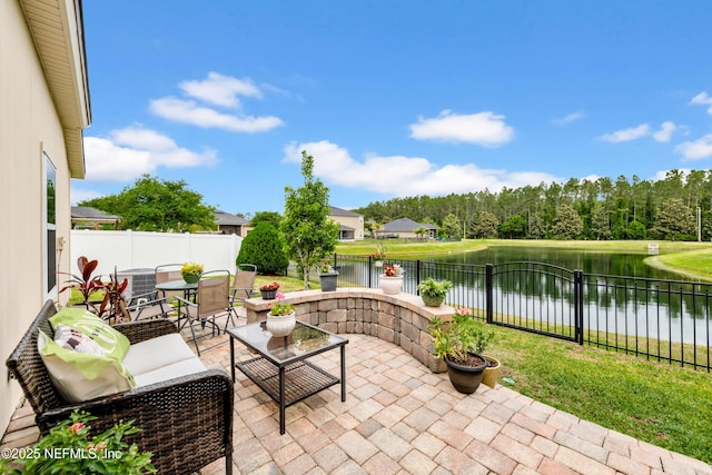 view of patio / terrace featuring central air condition unit, a water view, outdoor lounge area, and a fenced backyard