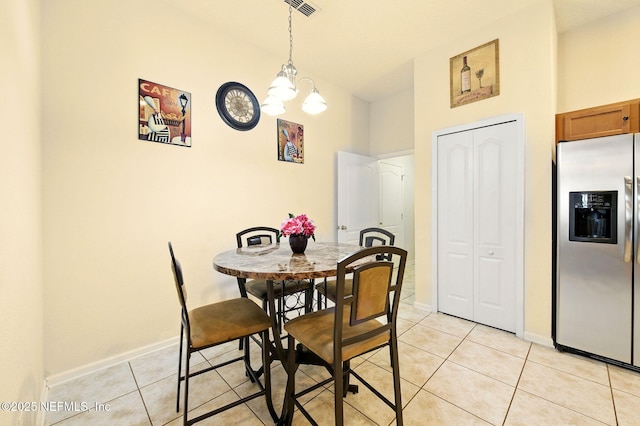 4023 Trail Ridge Rd, Middleburg, FL 32068 - dining space with light tile patterned flooring, a chandelier, and baseboards