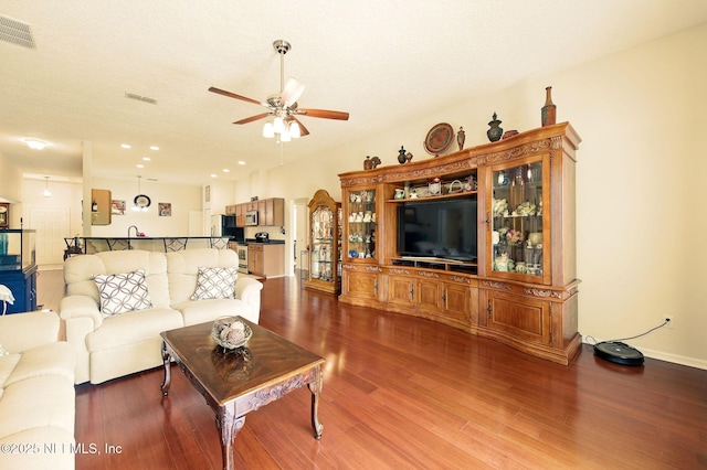 4023 Trail Ridge Rd, Middleburg, FL 32068 - living room with ceiling fan, dark wood-type flooring, arched walkways, baseboards, and recessed lighting