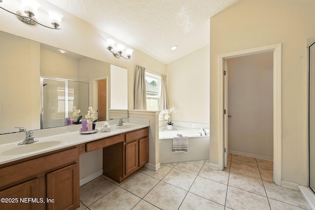 4023 Trail Ridge Rd, Middleburg, FL 32068 - bathroom with a textured ceiling, a stall shower, a garden tub, tile patterned flooring, and double vanity