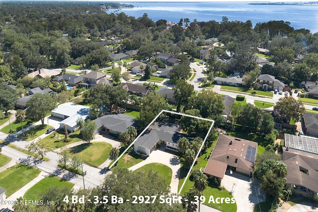 aerial view with a water view and a residential view