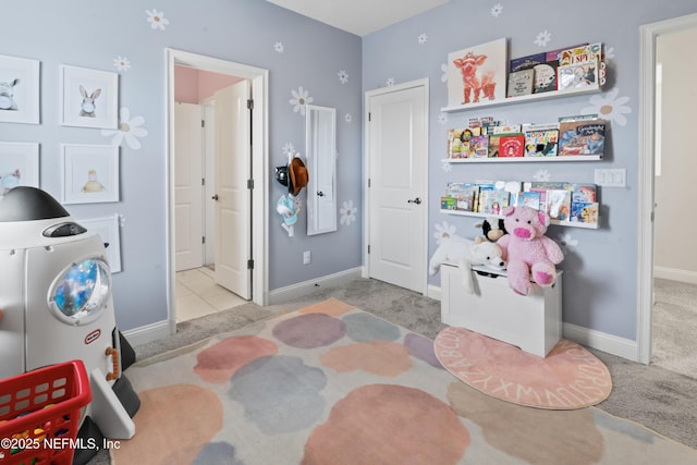 bedroom with carpet floors and baseboards