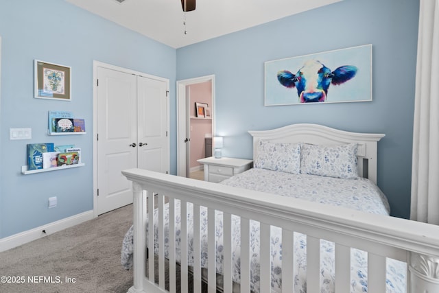 carpeted bedroom with a closet, ceiling fan, and baseboards