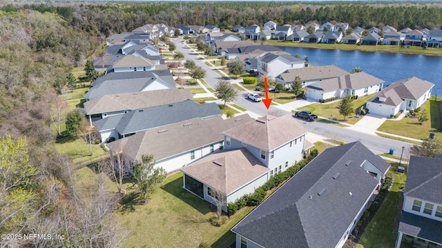 bird's eye view featuring a water view and a residential view