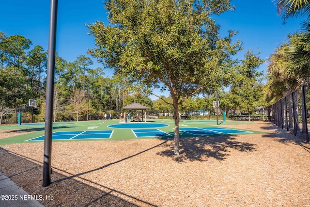 view of home's community with community basketball court, a gazebo, and fence