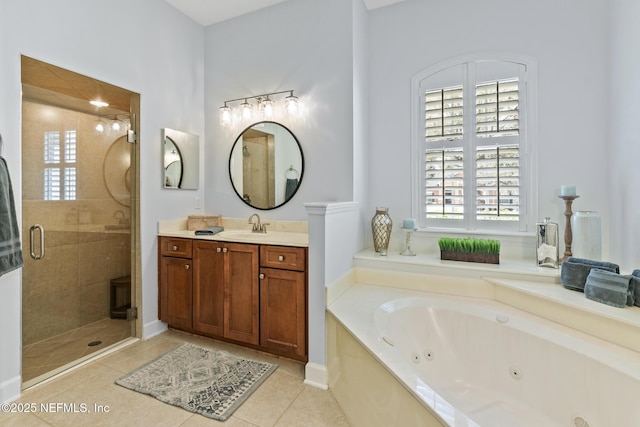 full bath with a whirlpool tub, a stall shower, tile patterned flooring, and vanity