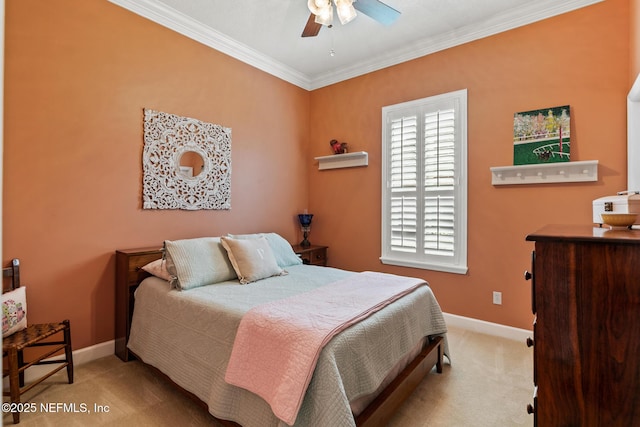 bedroom featuring baseboards, carpet flooring, a ceiling fan, and crown molding