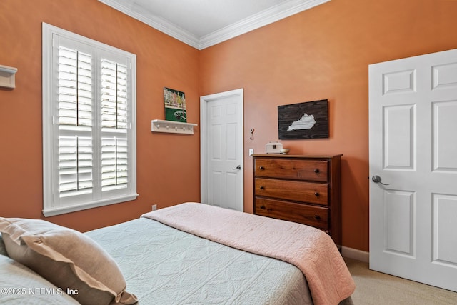 carpeted bedroom with baseboards and ornamental molding