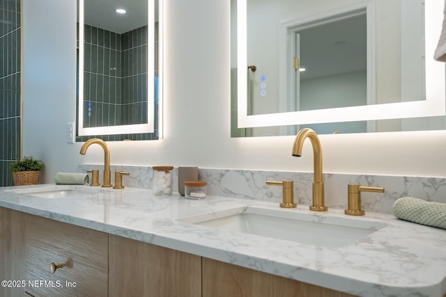 full bath featuring double vanity and a sink