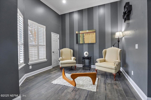 sitting room featuring baseboards, dark wood-style flooring, and ornamental molding