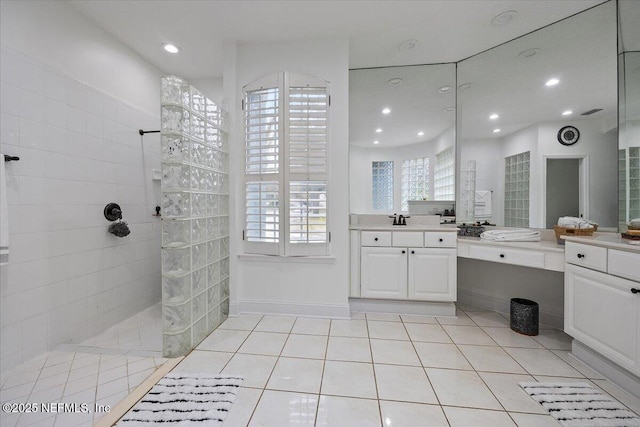 full bathroom featuring tile patterned flooring, vanity, recessed lighting, and walk in shower