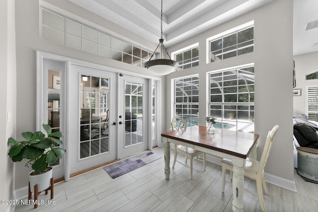 sunroom with visible vents and french doors