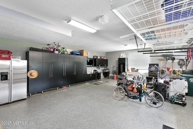 garage with stainless steel fridge with ice dispenser