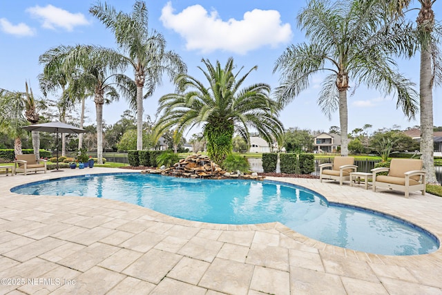 view of pool featuring a fenced in pool, a patio, and fence