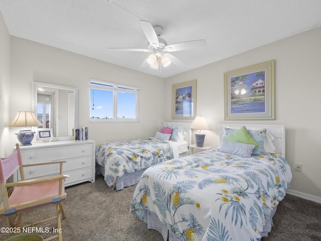 bedroom with a ceiling fan, carpet, and baseboards