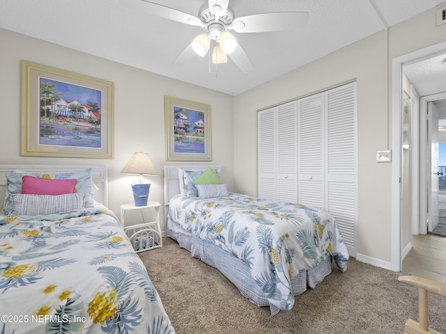 bedroom with visible vents, ceiling fan, baseboards, carpet, and a closet