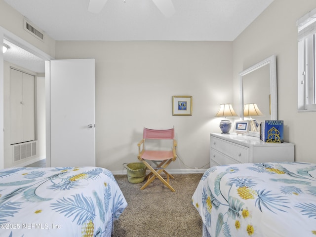 bedroom featuring carpet flooring, baseboards, visible vents, and a ceiling fan