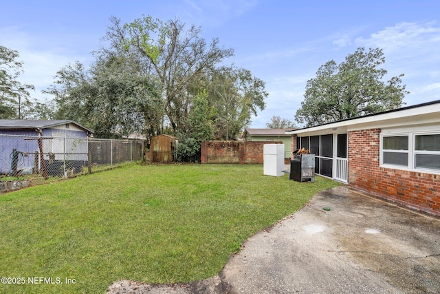 view of yard with fence and a patio