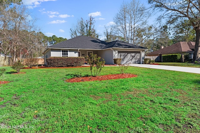 view of front of house with a garage, driveway, and a front lawn