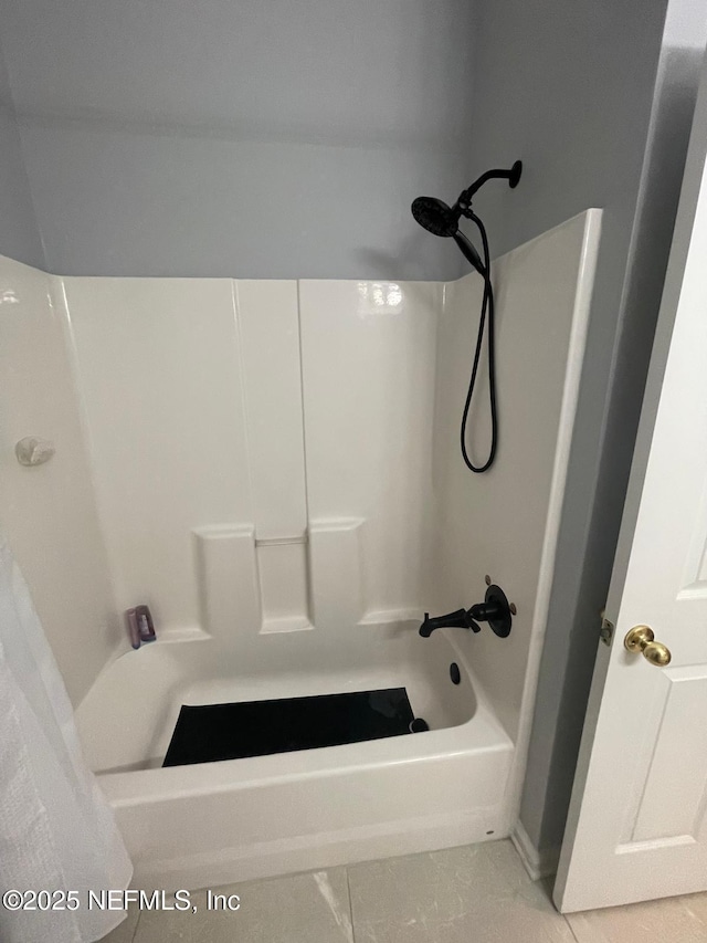 bathroom with shower / tub combination