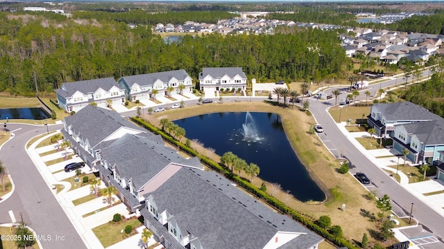 aerial view with a water view and a residential view