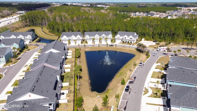 aerial view featuring a residential view and a water view