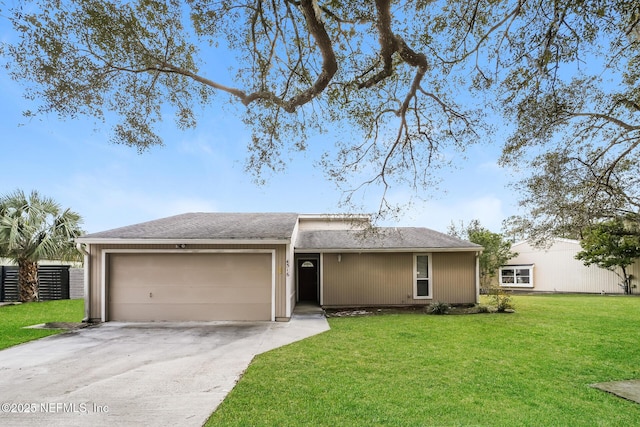 ranch-style home with an attached garage, driveway, and a front lawn