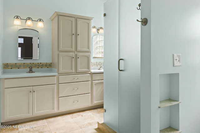180 Kingston Dr, Saint Augustine, FL 32084 - bathroom with tile patterned flooring, double vanity, and a sink