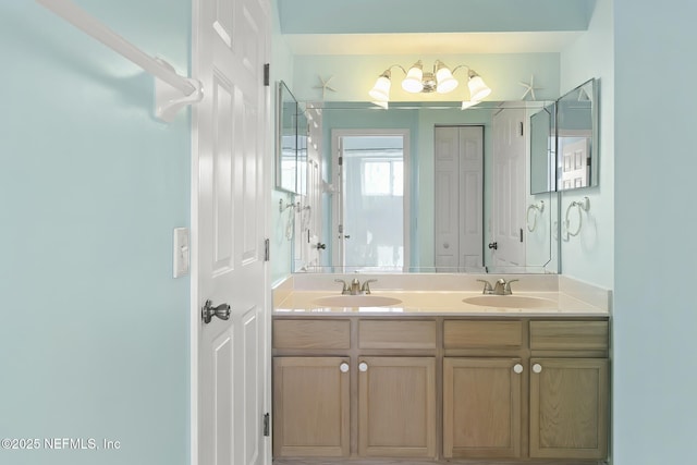 180 Kingston Dr, Saint Augustine, FL 32084 - full bath featuring an inviting chandelier, double vanity, and a sink