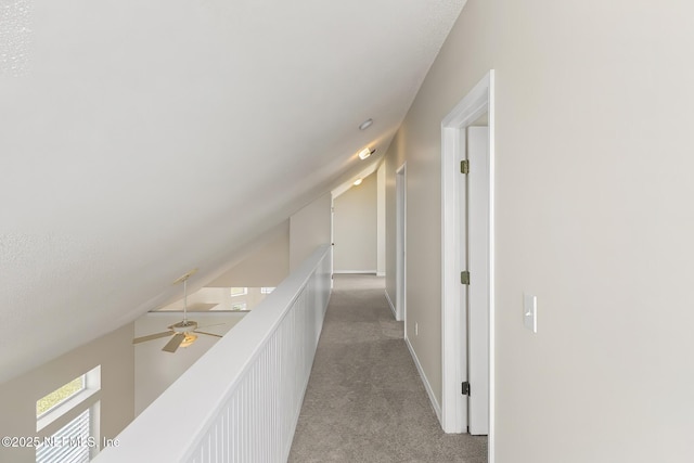 180 Kingston Dr, Saint Augustine, FL 32084 - hall featuring light colored carpet, baseboards, and lofted ceiling