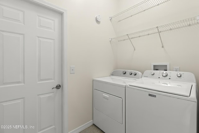 180 Kingston Dr, Saint Augustine, FL 32084 - laundry room featuring laundry area, washing machine and clothes dryer, and baseboards