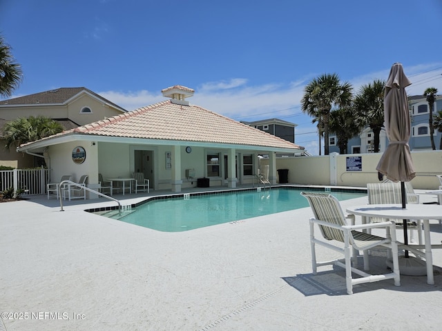 180 Kingston Dr, Saint Augustine, FL 32084 - community pool featuring a patio area and fence