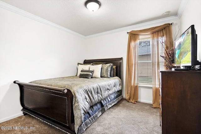 bedroom with baseboards, carpet flooring, and crown molding