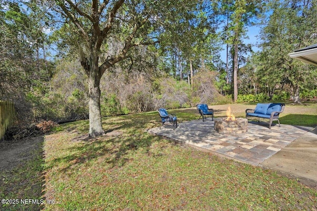 view of yard with a patio area and an outdoor fire pit