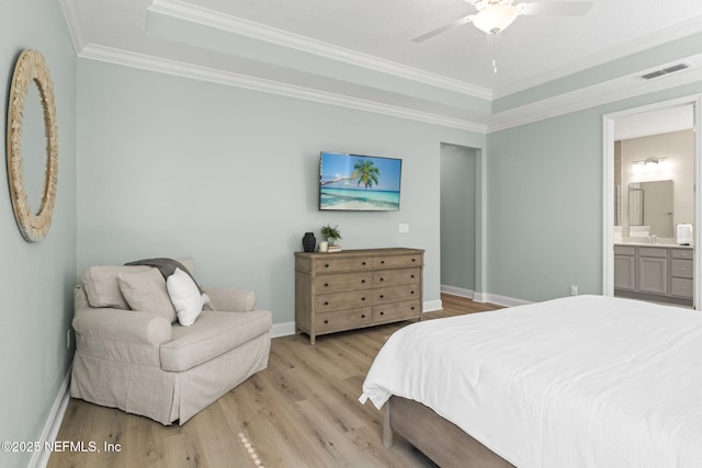 bedroom with light wood-type flooring, visible vents, crown molding, and baseboards