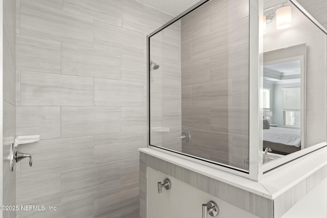 ensuite bathroom with tiled shower and ensuite bathroom