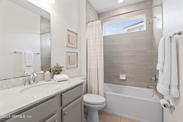 bathroom with vanity, toilet, and shower / tub combo with curtain