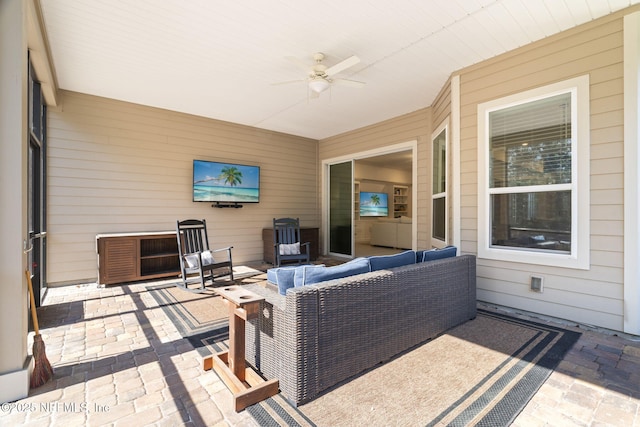 view of patio featuring an outdoor living space and a ceiling fan