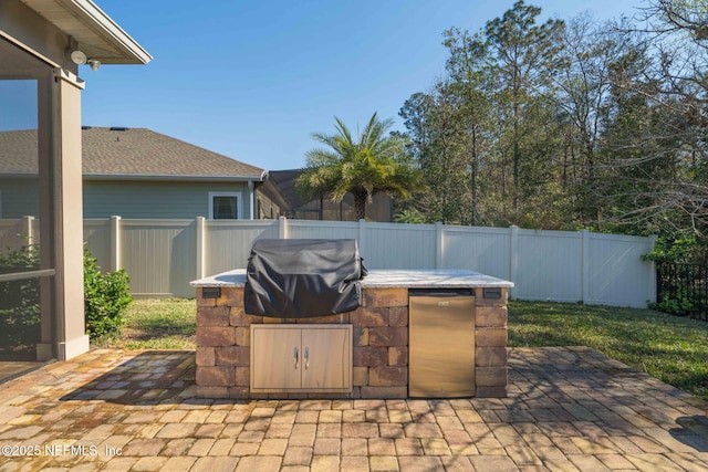 view of patio with a fenced backyard, grilling area, and area for grilling