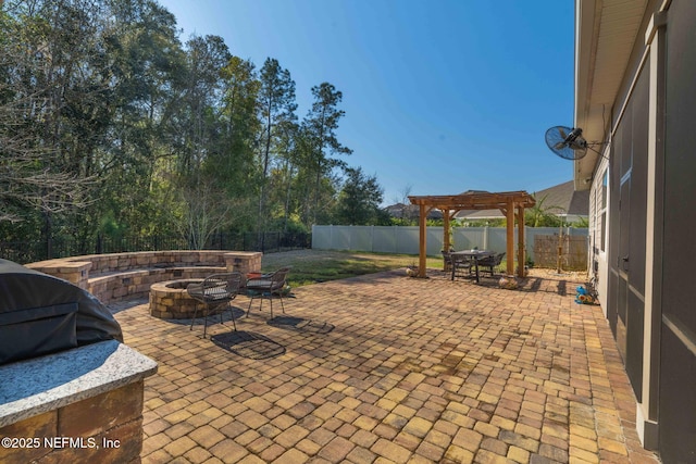 view of patio / terrace featuring a fenced backyard, a grill, a fire pit, and a pergola