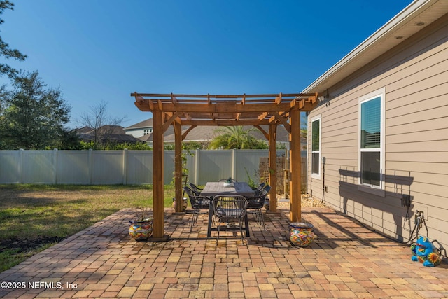 view of patio / terrace featuring outdoor dining space, a fenced backyard, and a pergola