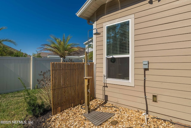 view of property exterior featuring fence