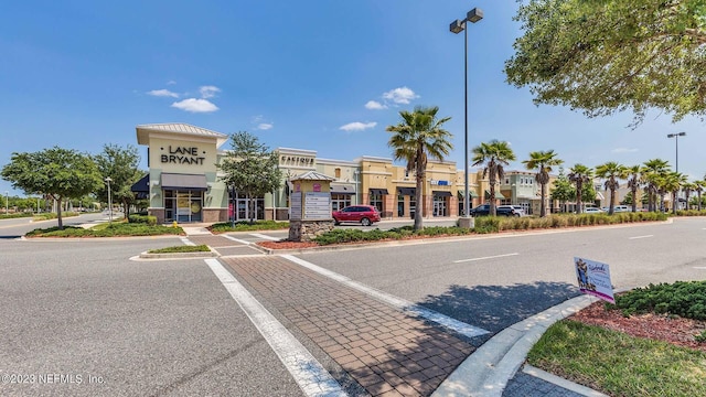 exterior space featuring street lighting, curbs, and sidewalks