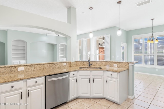 kitchen with built in features, visible vents, light tile patterned flooring, a sink, and dishwasher