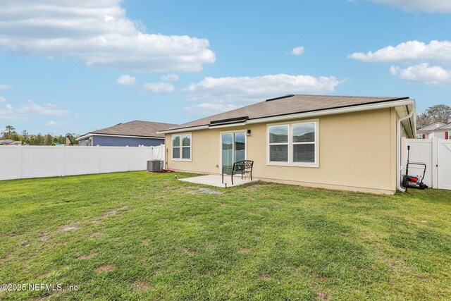 back of property featuring a patio, a fenced backyard, central air condition unit, a lawn, and stucco siding