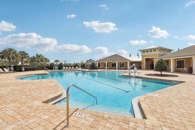 community pool featuring a patio area