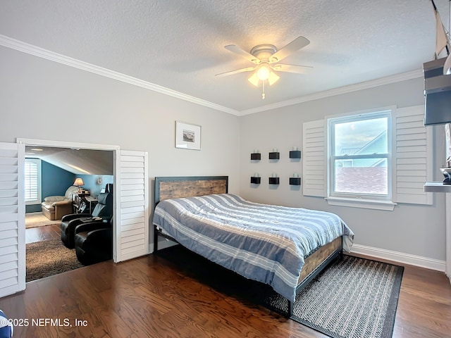 bedroom featuring a textured ceiling, wood finished floors, and crown molding