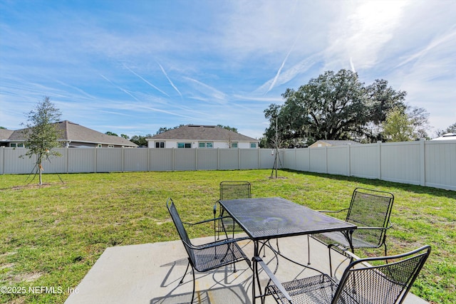 view of patio featuring outdoor dining space and a fenced backyard